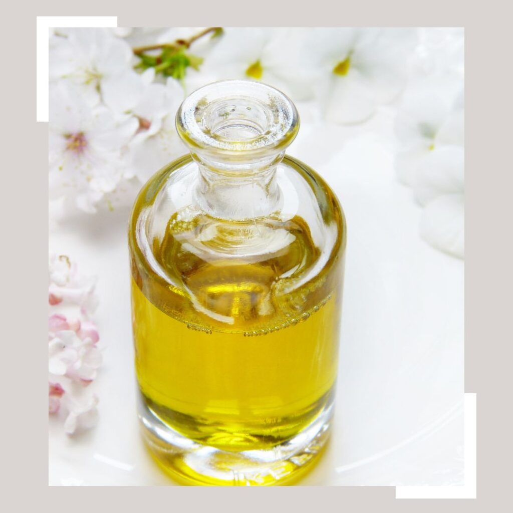 Thick Carrier oil with a white background and flowers
