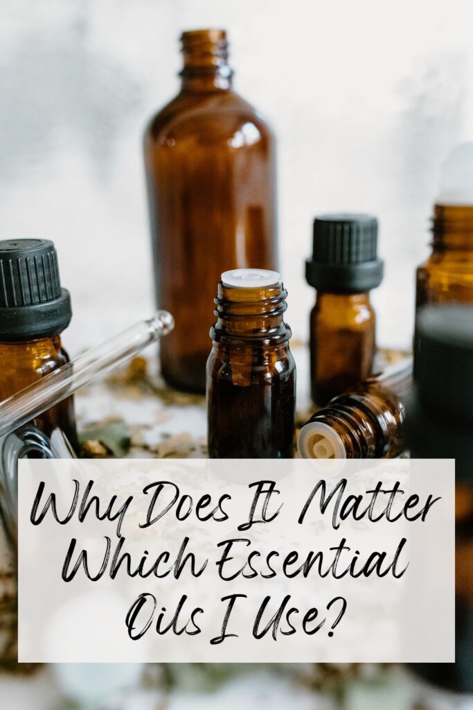 Pinterest Image Why Does It Matter What Essential Oils I use? Essential Oil Bottles scattered throughout the