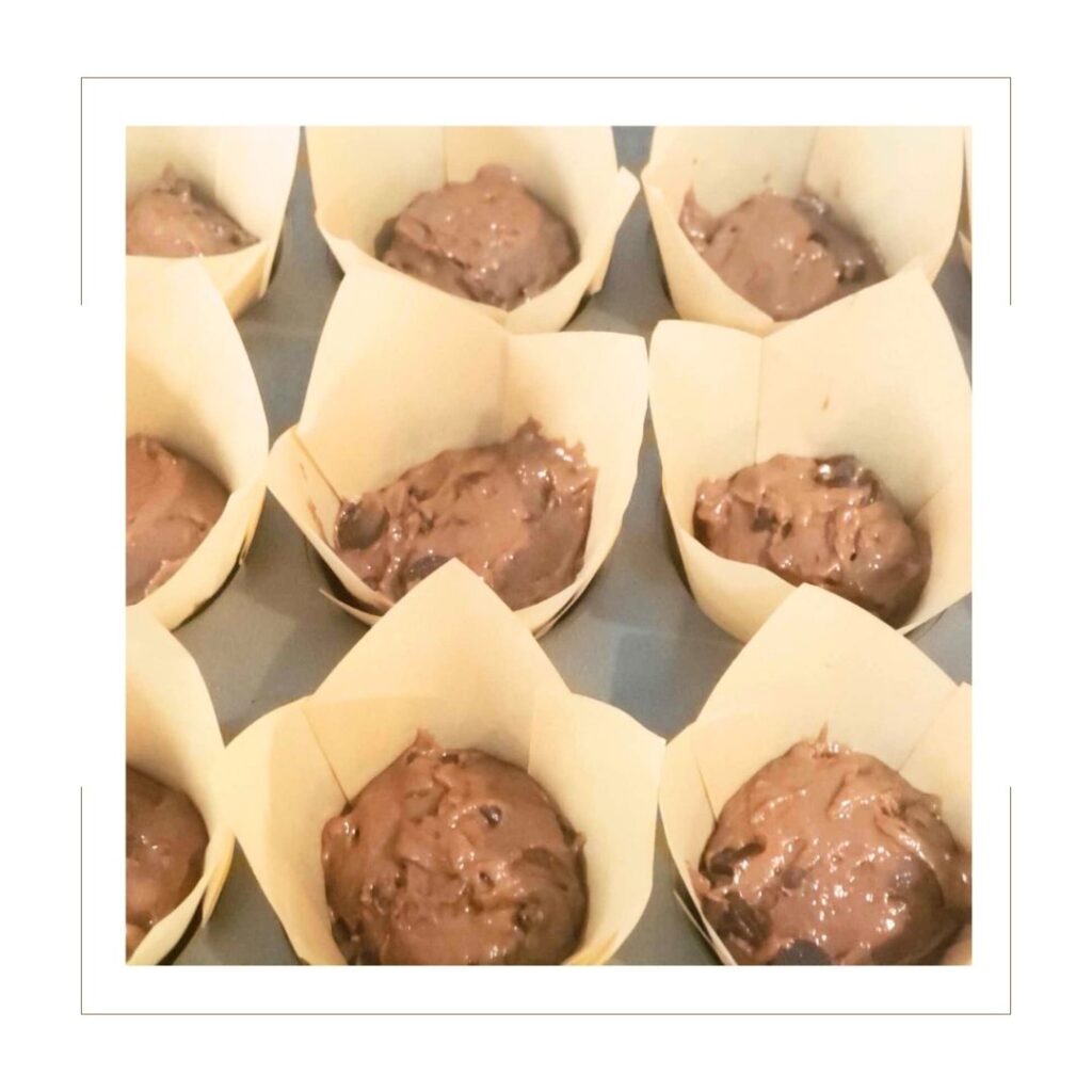 Triple chocolate muffin wet batter in muffin tin