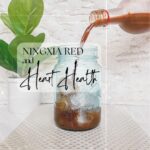 Ningxia Red and Heart Health, Ningxia pouring into a mason jar with a small plant in the back.
