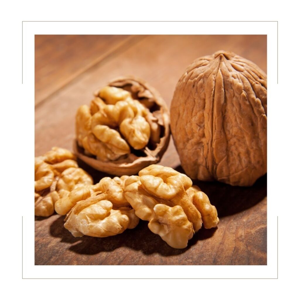 Whole and Shelled Walnuts on a cutting board