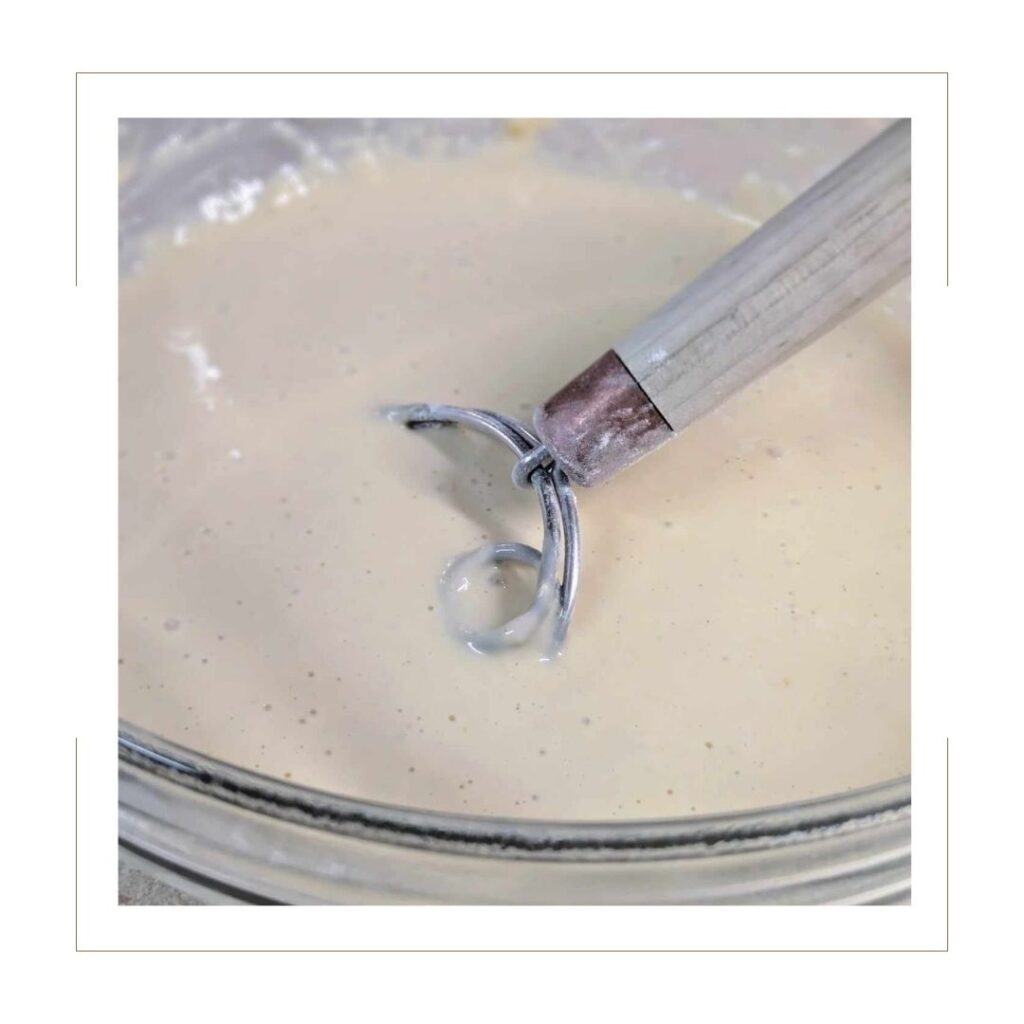 Waffle Batter in glass bowl with dough hook