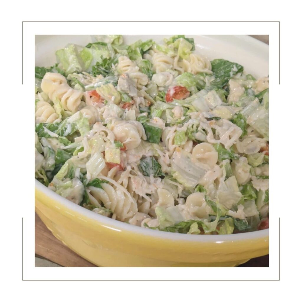 Caesar Salad Pasta Salad in a yellow bowl