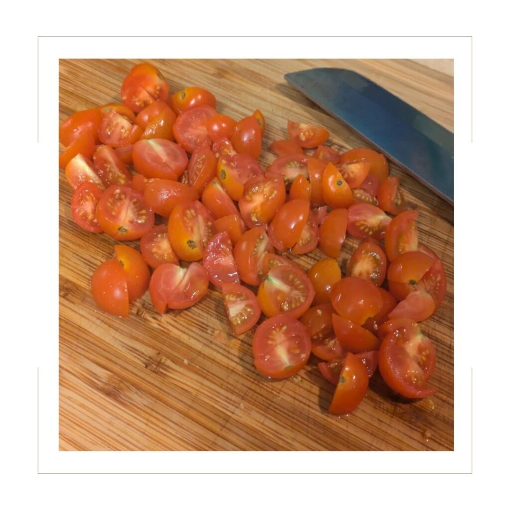 Diced tomatoes on a cutting board.