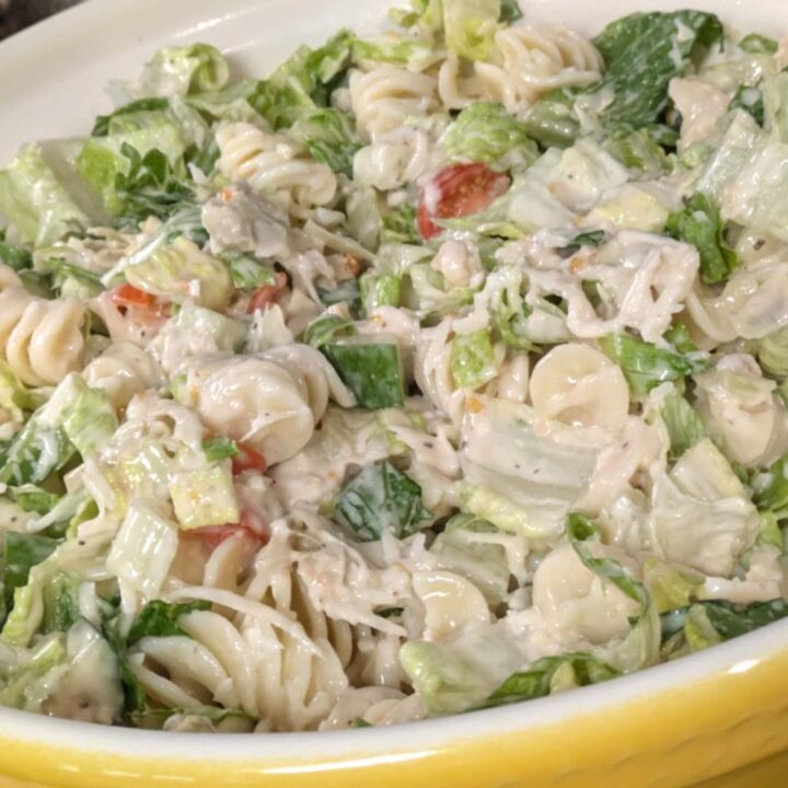 Caesar Salad Pasta Salad in a yellow bowl.