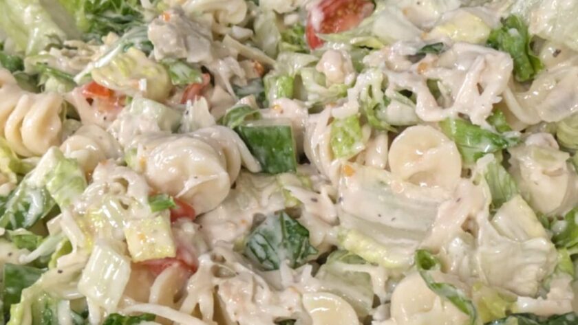 Caesar Salad Pasta Salad in a yellow bowl.