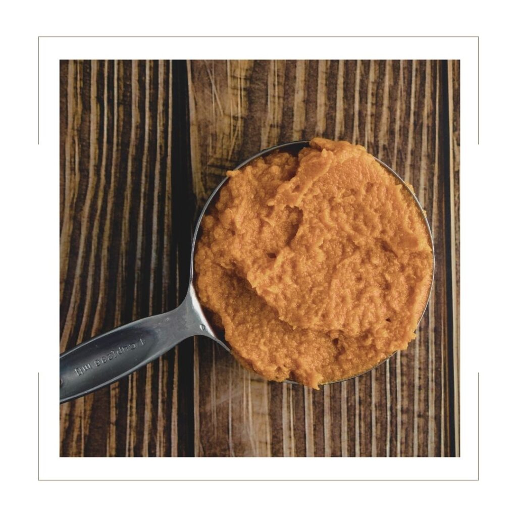 Pumpkin Puree in a measuring cup