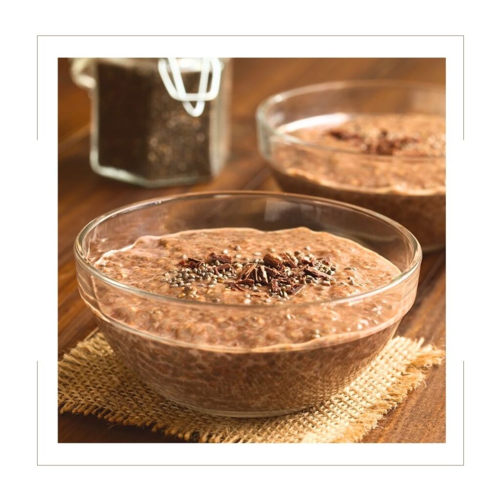 Chocolate Chia Seed Pudding in glass bowl on a wooden board with burlap