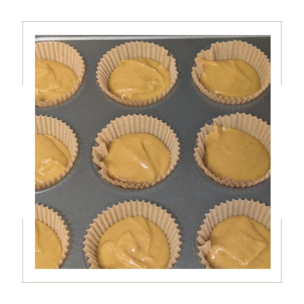 Batter for Pumpkin Spice Cupcakes in muffin tin