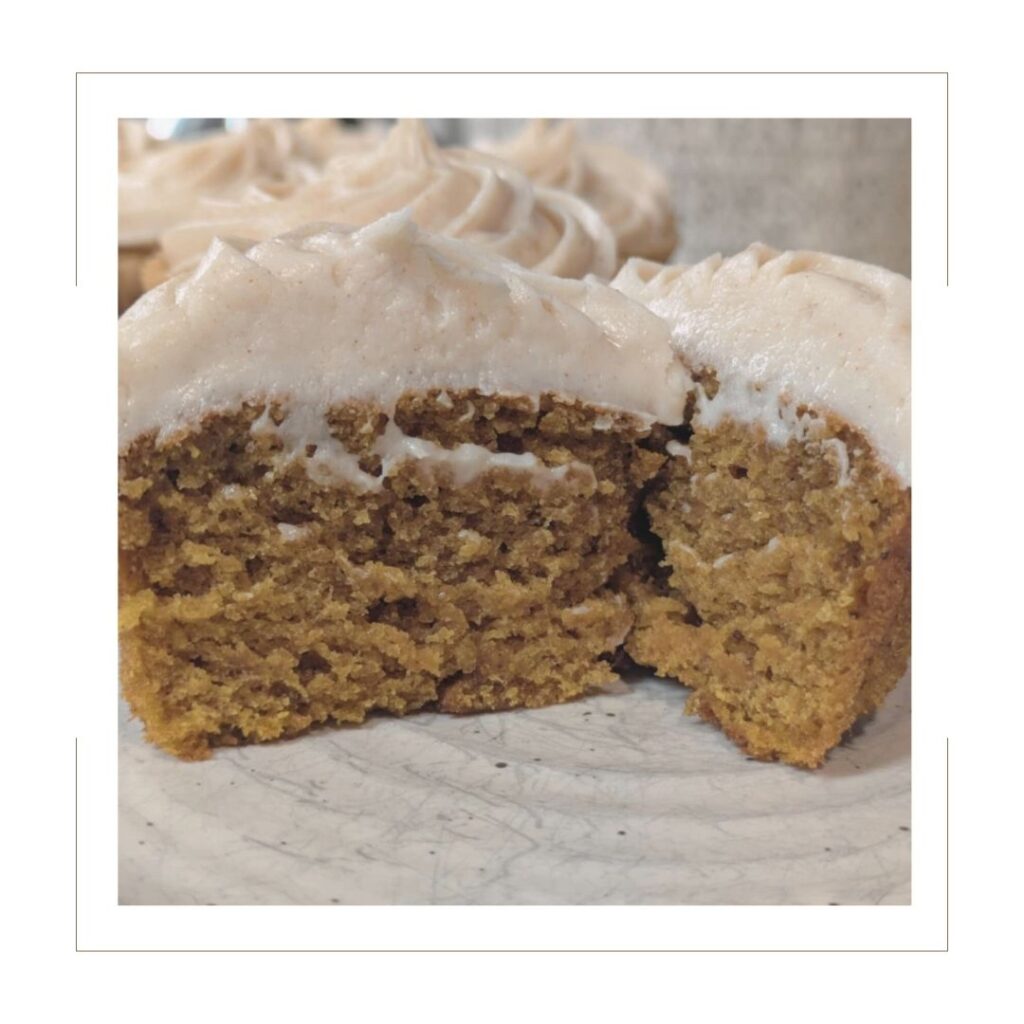 Pumpkin Spice Cupcake with Cream Cheese Icing cut in half