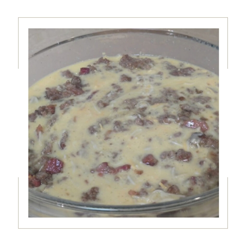 Cooked sausage and bacon crumbles together in the skillet