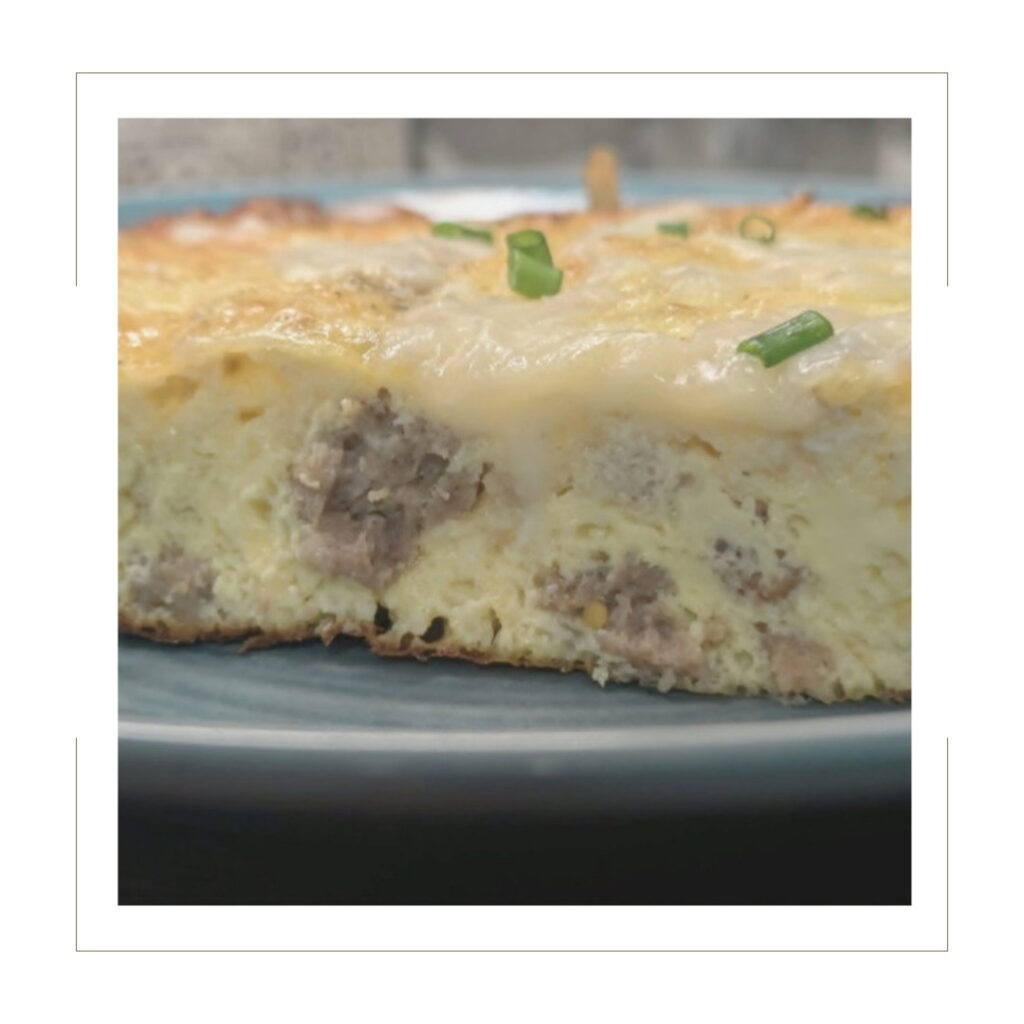 Whisking eggs and Greek yogurt together in a glass bowl for the egg bake recipe