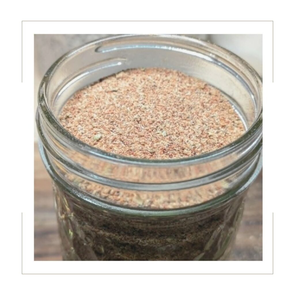 Homemade taco seasoning stored in a tall mason jar