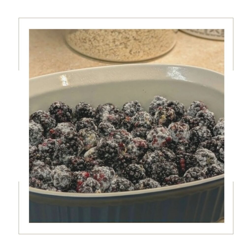 Blackberries and flour in a baking dish